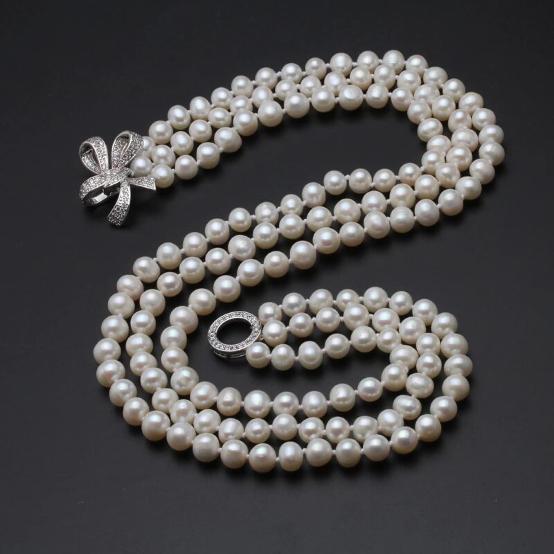 7-8mm Near Round.  White Freshwater Pearl Necklace. 3 Strands.  Natural Flaws.  Silver Clasp.