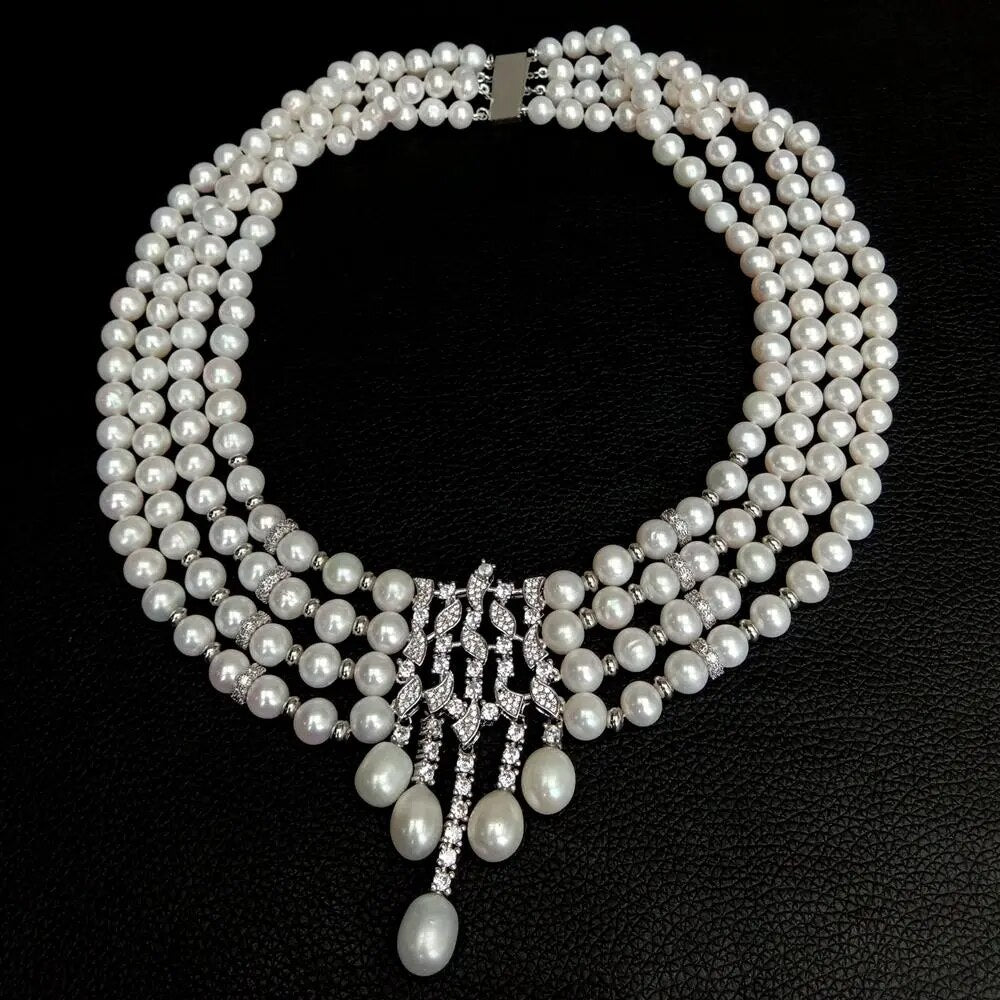 8-9mm Near Round.  White Freshwater Pearl Necklace.   4 Strands.   Natural Flaws.   With Cubic Zirconia Pave Teardrop Shape Pearl Pendant.