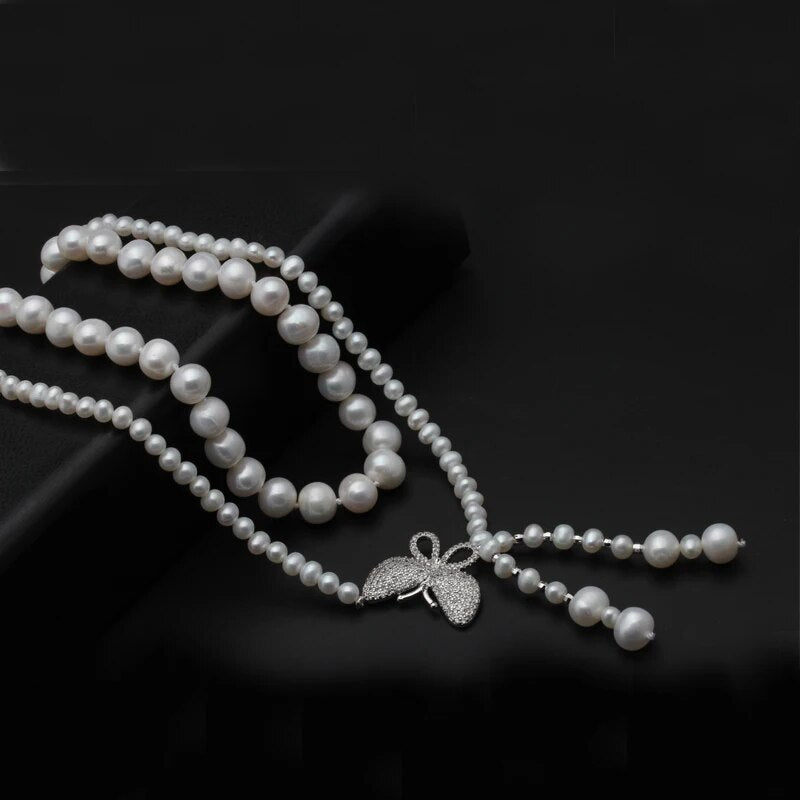5-6mm, 8-9mm Oval Shape.  White Freshwater Pearl Necklace.  2Strands.   Natural Flaws.  Silver Clasp.